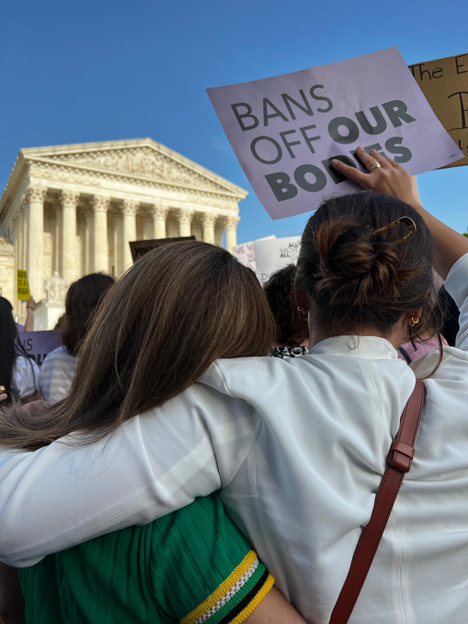 Women embrace in front of SCOTUS 4/3/22